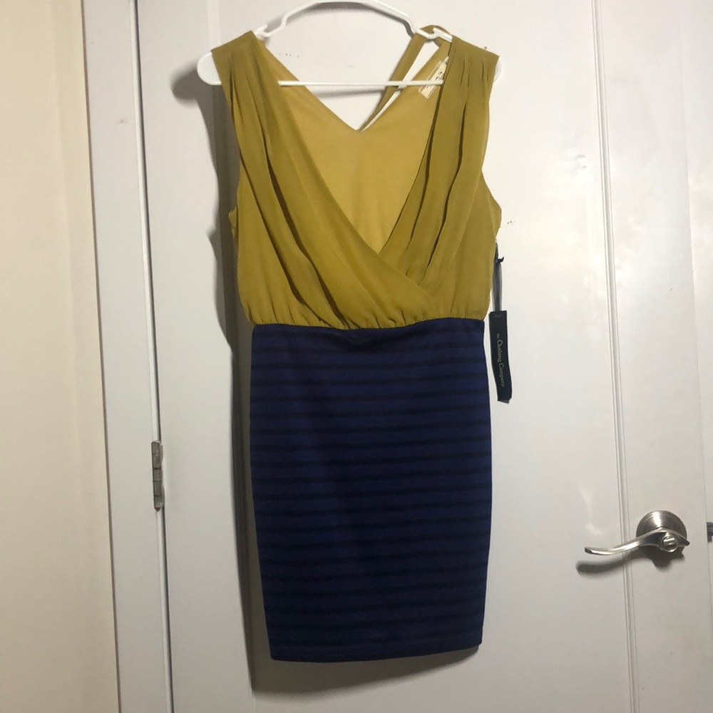 body con dress with mustard v neck top, black and blue striped bottom